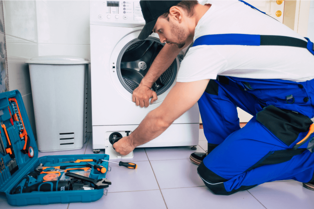 Dubai Repair Pro technician fixing a washing machine in a Dubai home